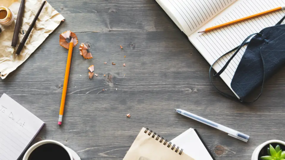 Documents, charts and a notebook laid out for research