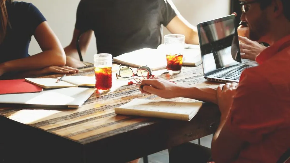 A team reviewing documents together at a meeting table